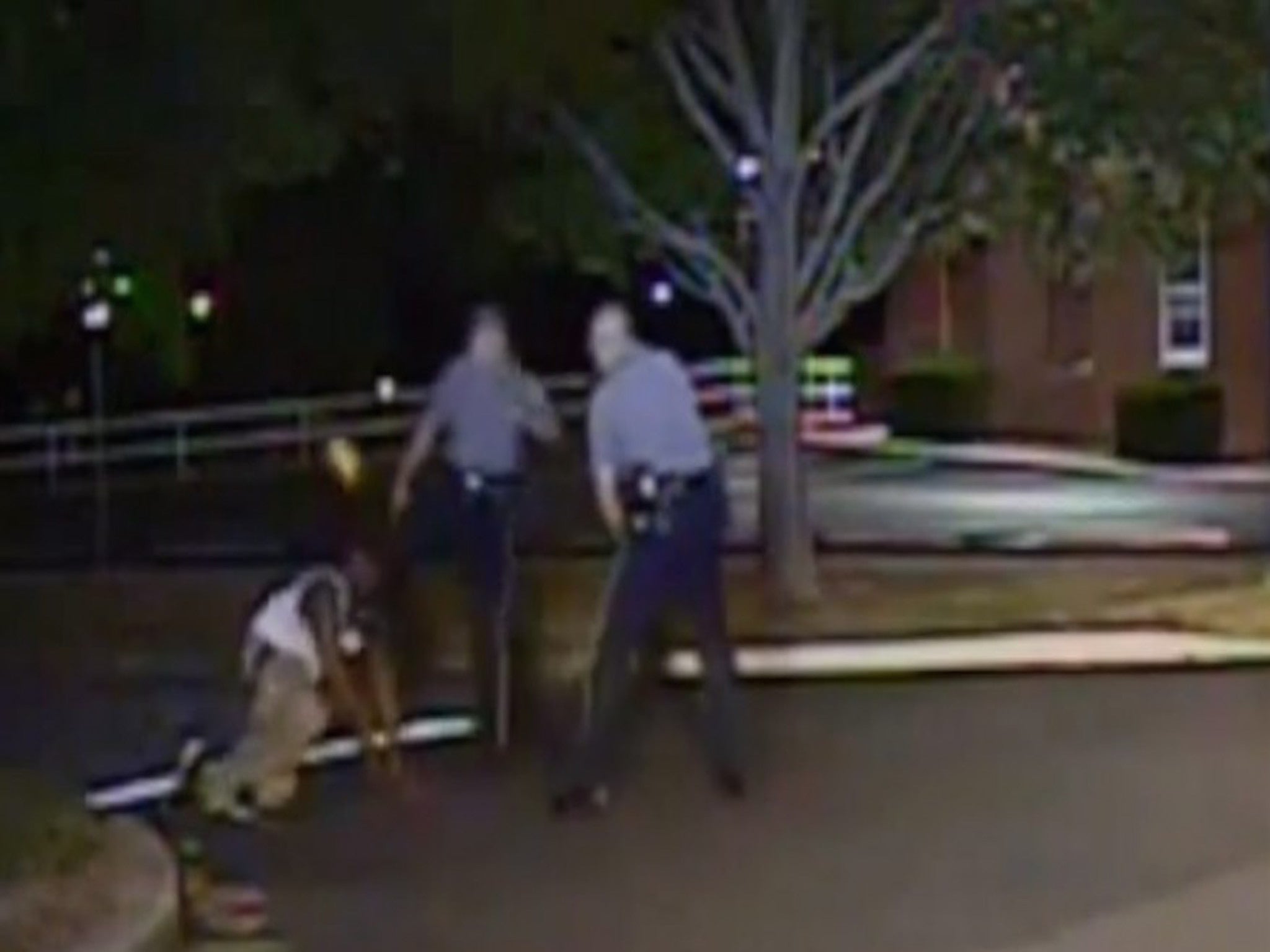 Dashcame footage shows a white officer kicking a black suspect in the teethe