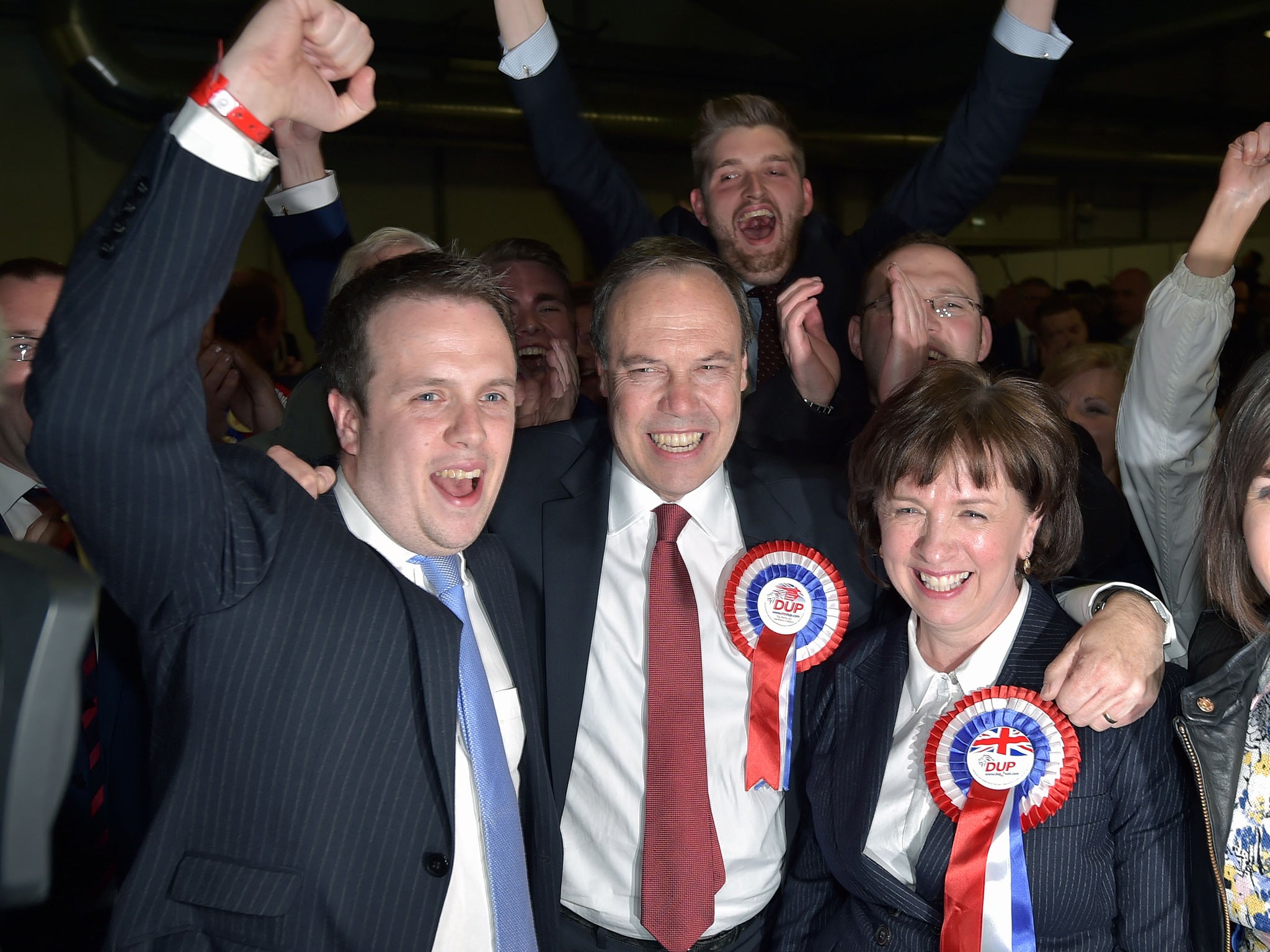 DUP Wesminster leader Nigel Dodds (C) celebrates with his wife Diane Dodds (R) after his win