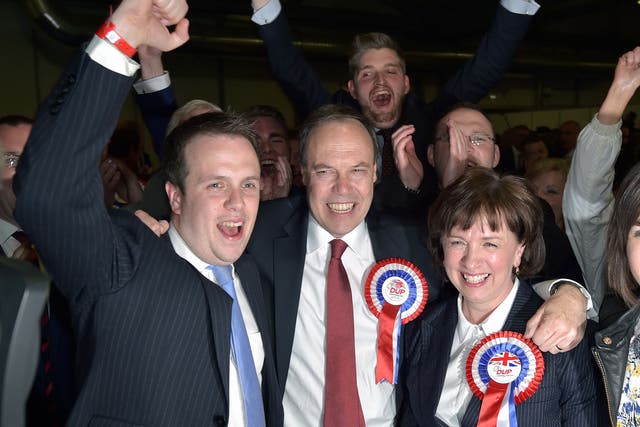 DUP Wesminster leader Nigel Dodds (C) celebrates with his wife Diane Dodds (R) after his win