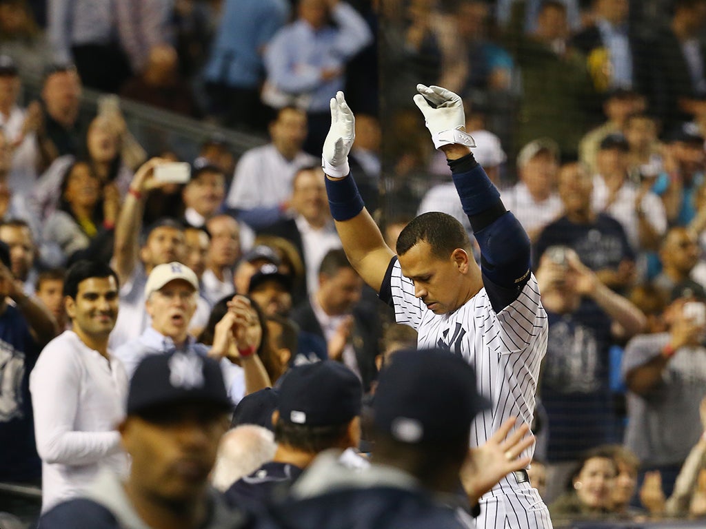 Alex Rodriguez #13 of the New York Yankees waves to the crowd after hitting his 661st home run