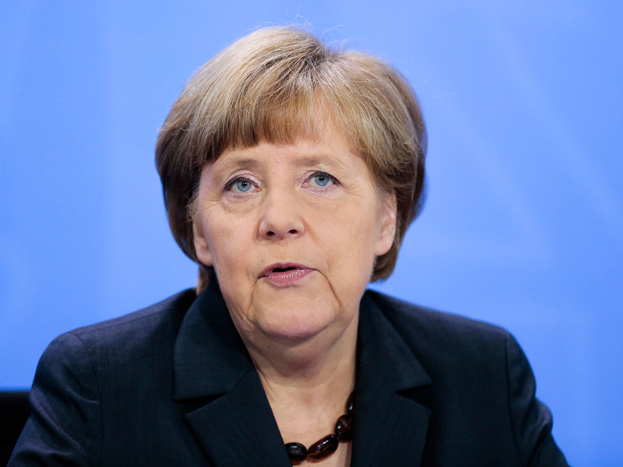 Chancellor Angela Merkel, pictured at a news conference yesterday, is said to have known about German co-operation with the NSA