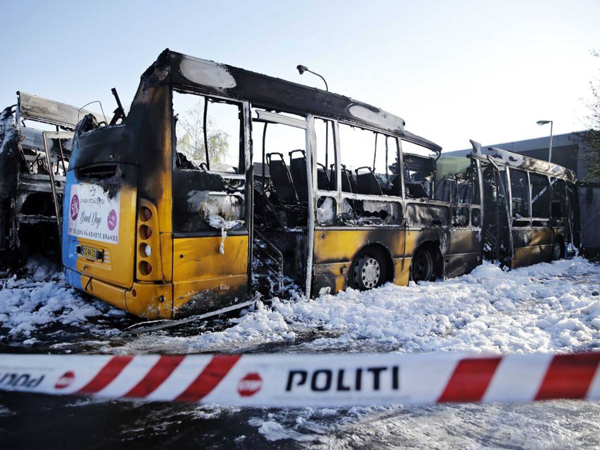 Four buses at Copenhagen Bus Company Arriva's garage in Oesterbro