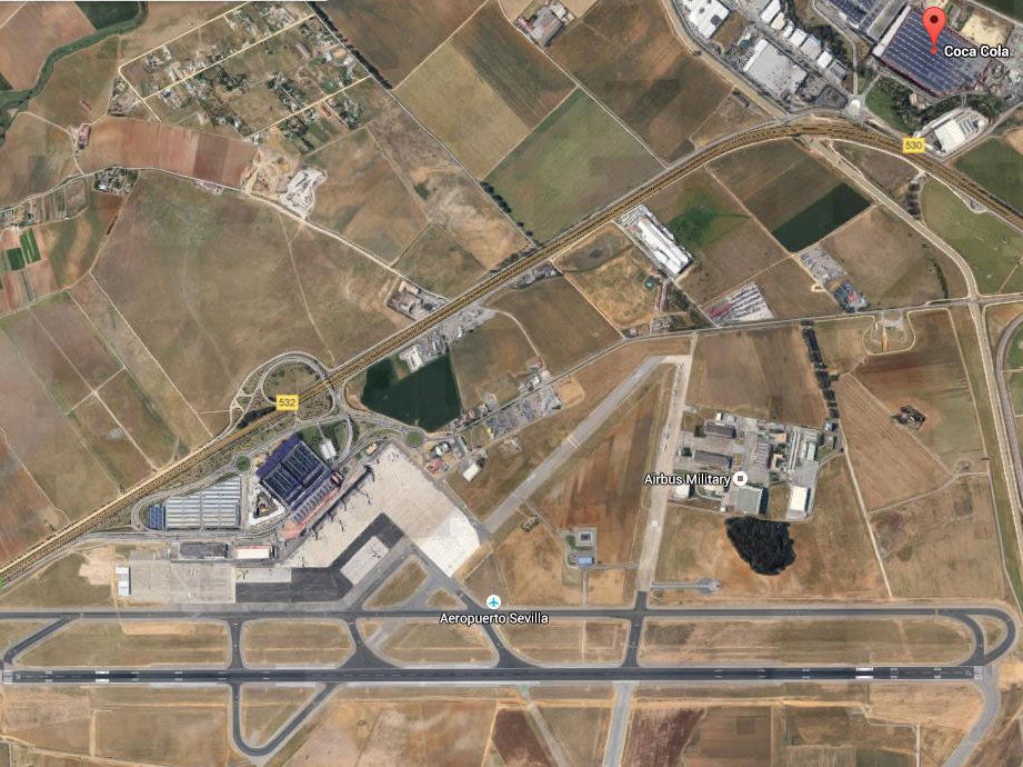 The Coca-Cola factory lies just north of Seville Airport, which houses an Airbus Military testing facility