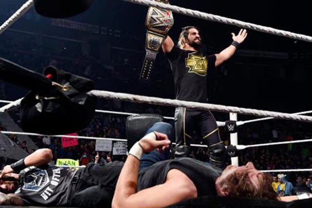 Seth Rollins shows off his WWE World Heavyweight Championship