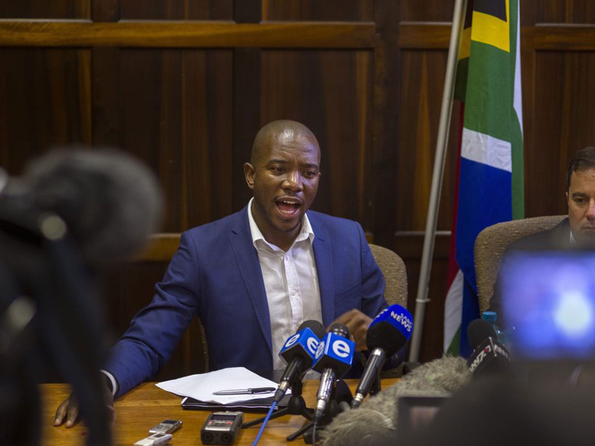 Mmusi speaking to the press after his party walked out of parliament in protest against the speaker (Getty Images)