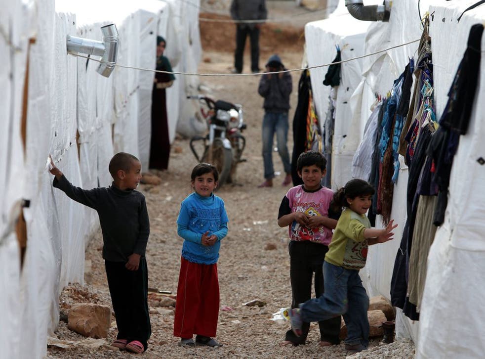 Syrian children play in one of the number of Syrian refugee camps in Lebanon (Joseph Eid)