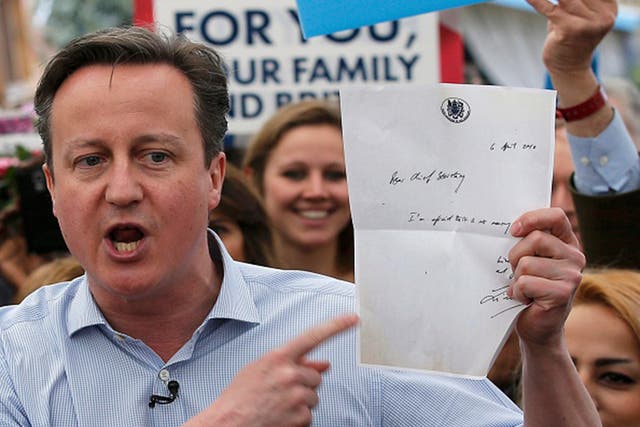 British Prime Minister David Cameron holds up a letter from former Labour Treasury Minister Liam Byrne during the 2015 election campaign