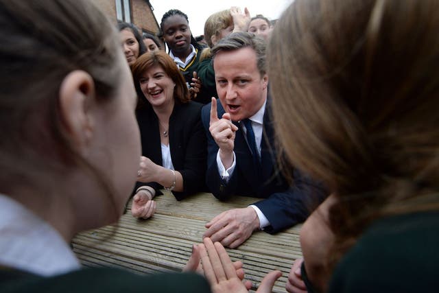 Education secretary Nicky Morgan and Prime Minister David Cameron meet pupils at a London school after announcing their pledge to open 500 more free schools over the course of the next parliament. 
