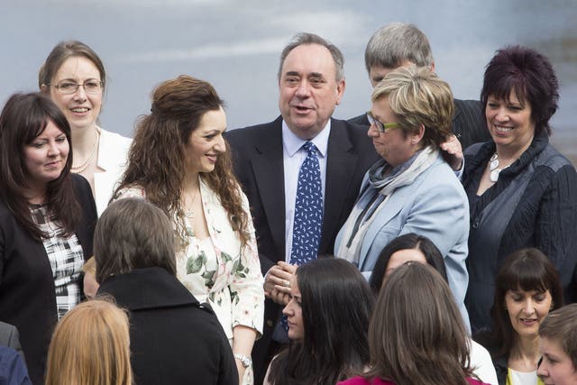 Former first minister of Scotland Alex Salmond (centre) joins fellow newly-elected SNP MPs in front of the Forth Rail Bridge in South Queensferry as the party marks its historic landslide general election victory in Scotland