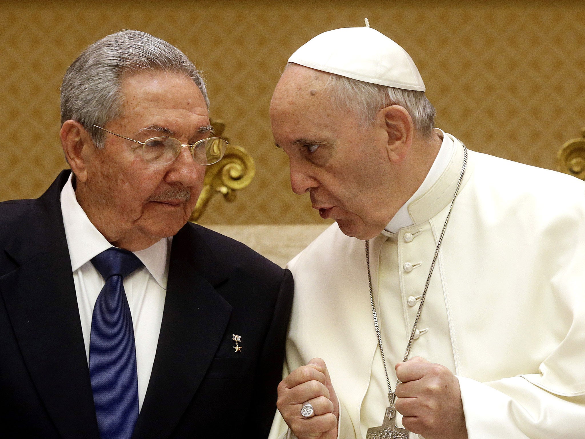 Pope Francis, right, talks with Cuban President Raul Castro during a private audience at the Vatican, Sunday, May 10, 2015