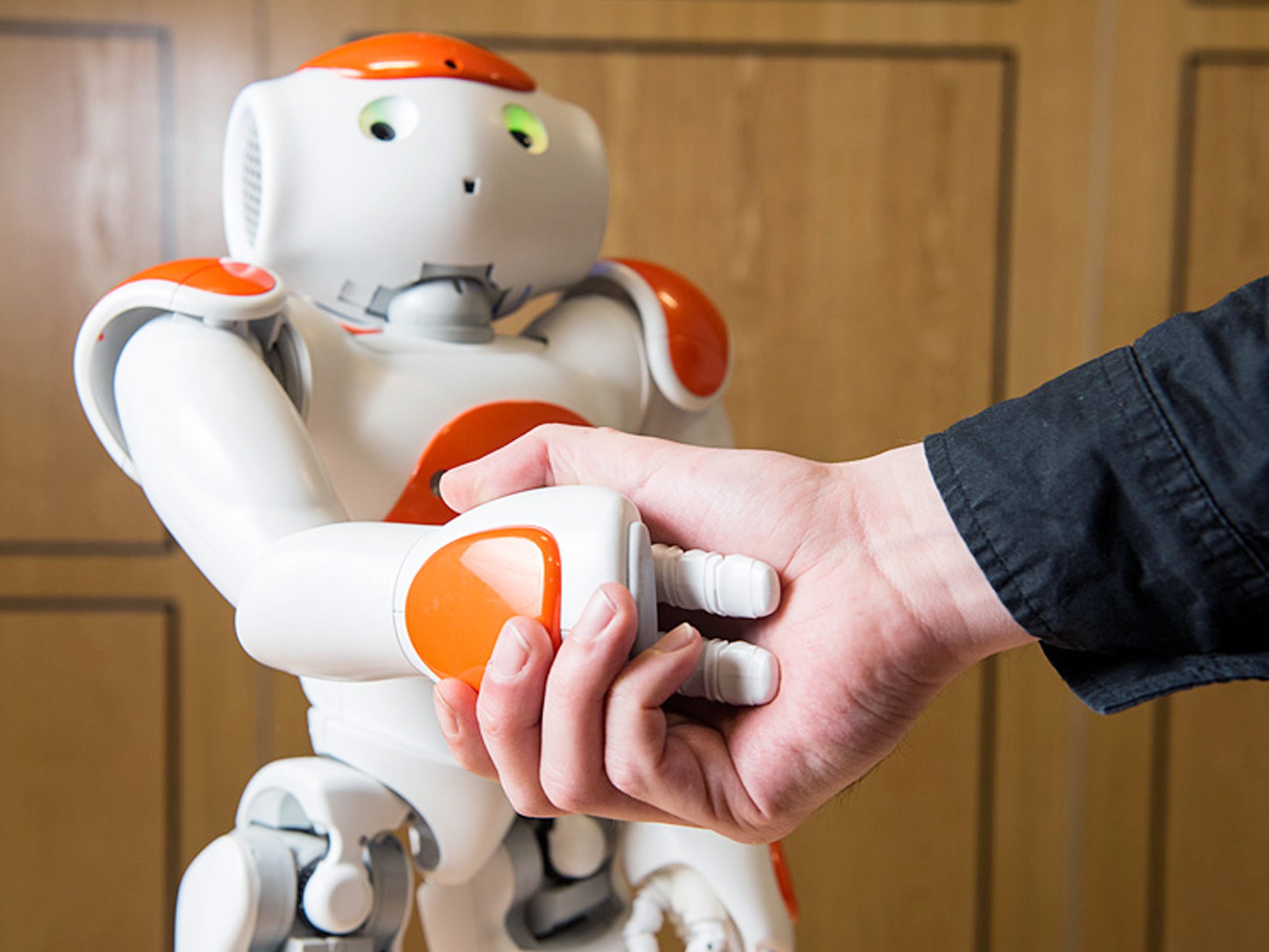 A robot called Nao showed a handshake builds trust when it represented one party in a mock house sale, a study found