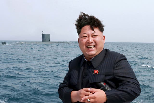 North Korean leader Kim Jong Un watches the test-fire of a strategic submarine underwater ballistic missile (not pictured) 