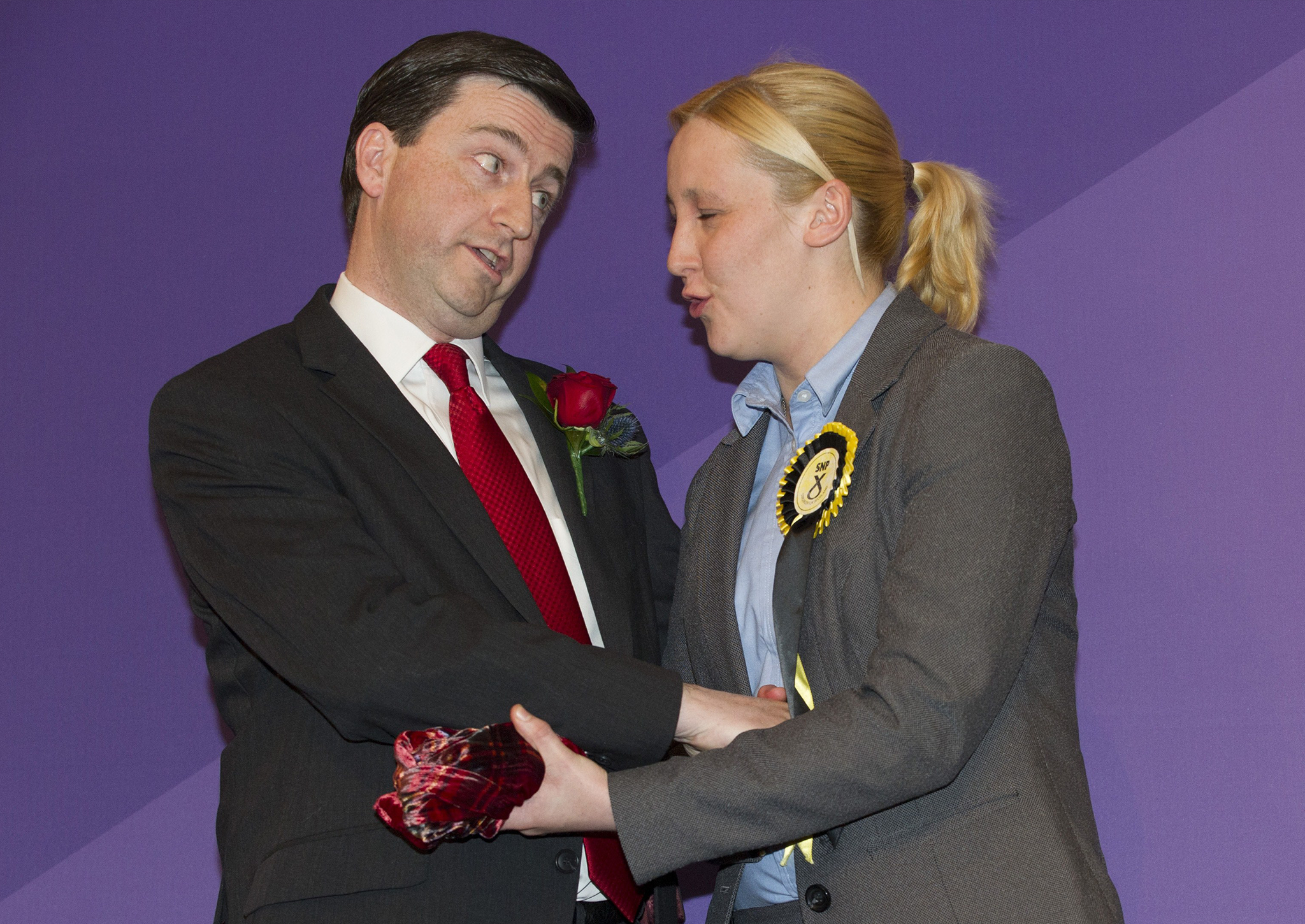 Mhairi Black, Britain's youngest member of parliament since 1667, greets Labour candidate Douglas Alexander during the declaration of the general election results for Paisley and Renfrewshire South