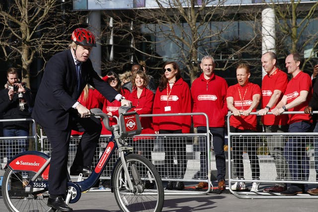Mayor of London, Boris Johnson rides a bicycle during the announcement of Santander as the new sponsor of Santander Cycles on 27, 2015 in London, England