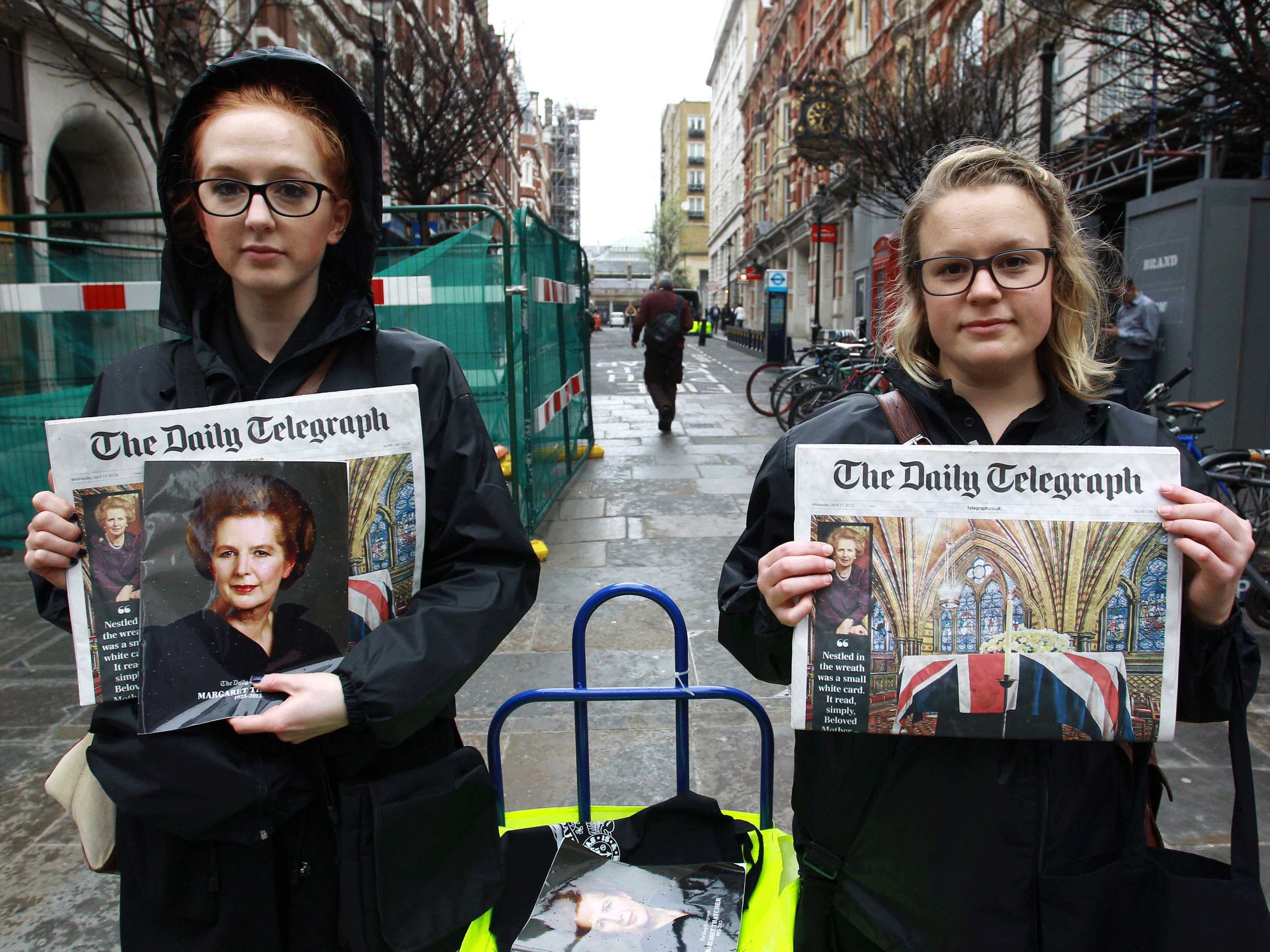 Street vendors with copies of The Daily Telegraph on the day of Margaret Thatcher's funeral on 17 April, 2013