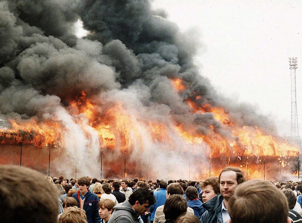 Spectators in front of the Bradford City blaze in 1985