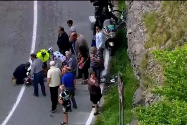 Paramedics treat Pozzovivo following the nasty crash on the Giro's third stage