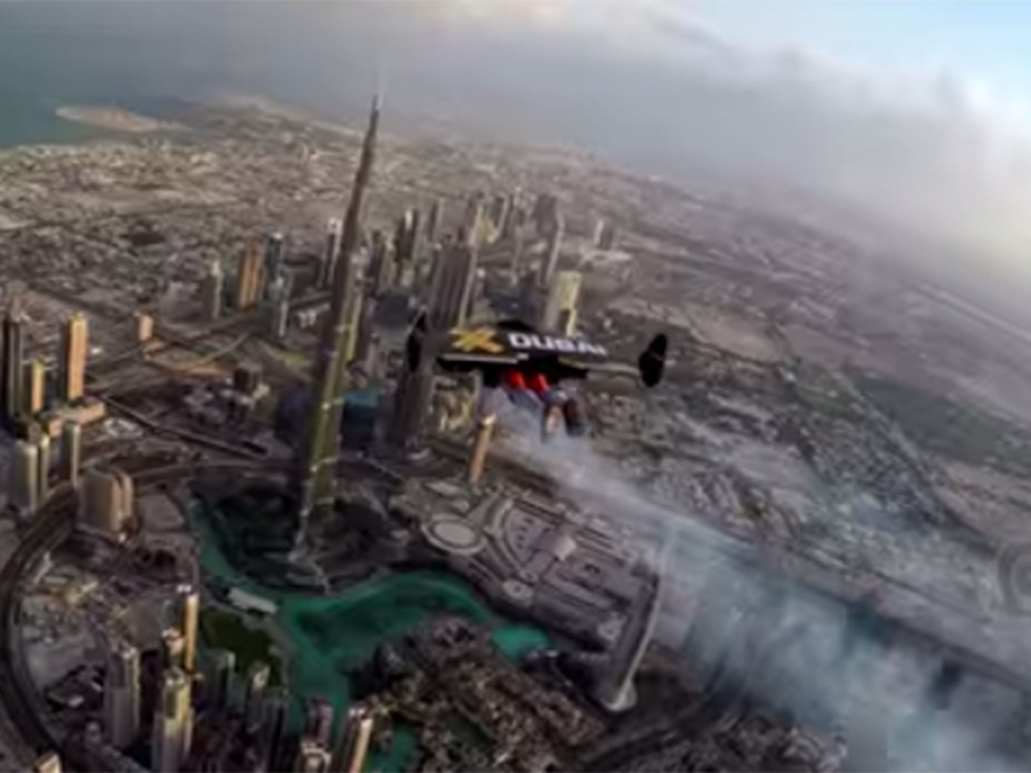 Yves Rossi flying above Dubai with his jetpack wingsuit