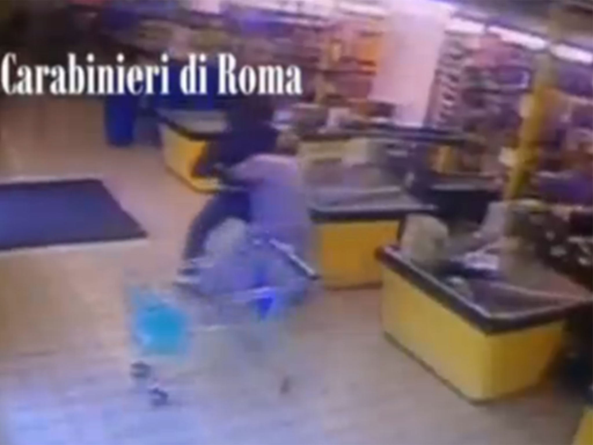 The off-duty officer got the armed robber in a bear hug