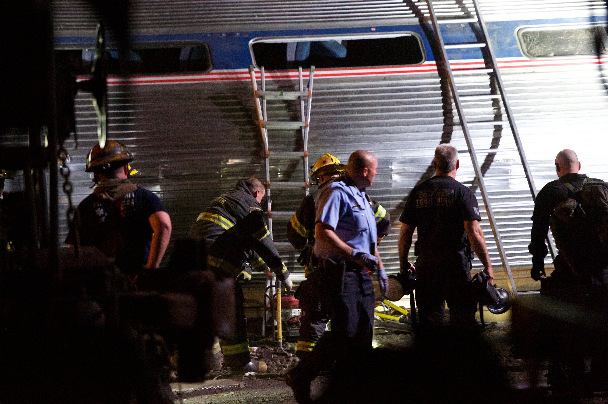 Emergency teams at the scene of the crashed train, which was carrying 243 people