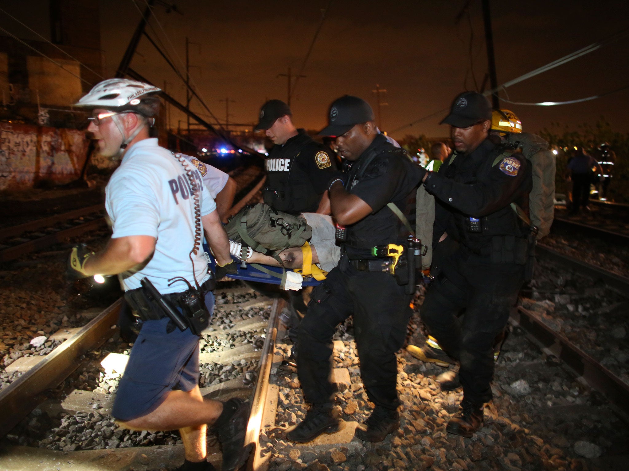 Emergency personnel carry an injured person