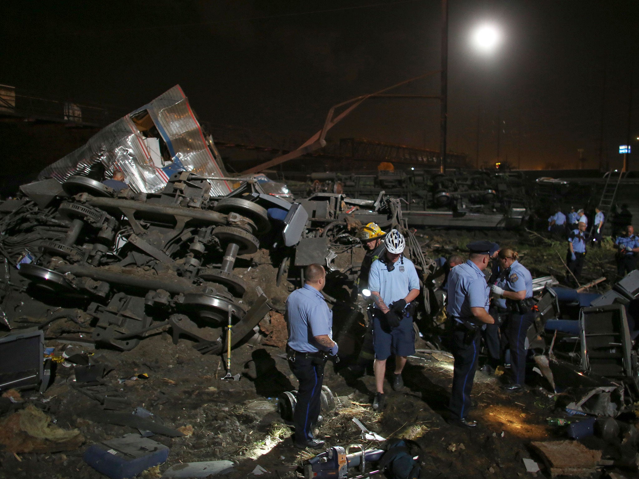 Emergency personnel work the scene of a train wreck