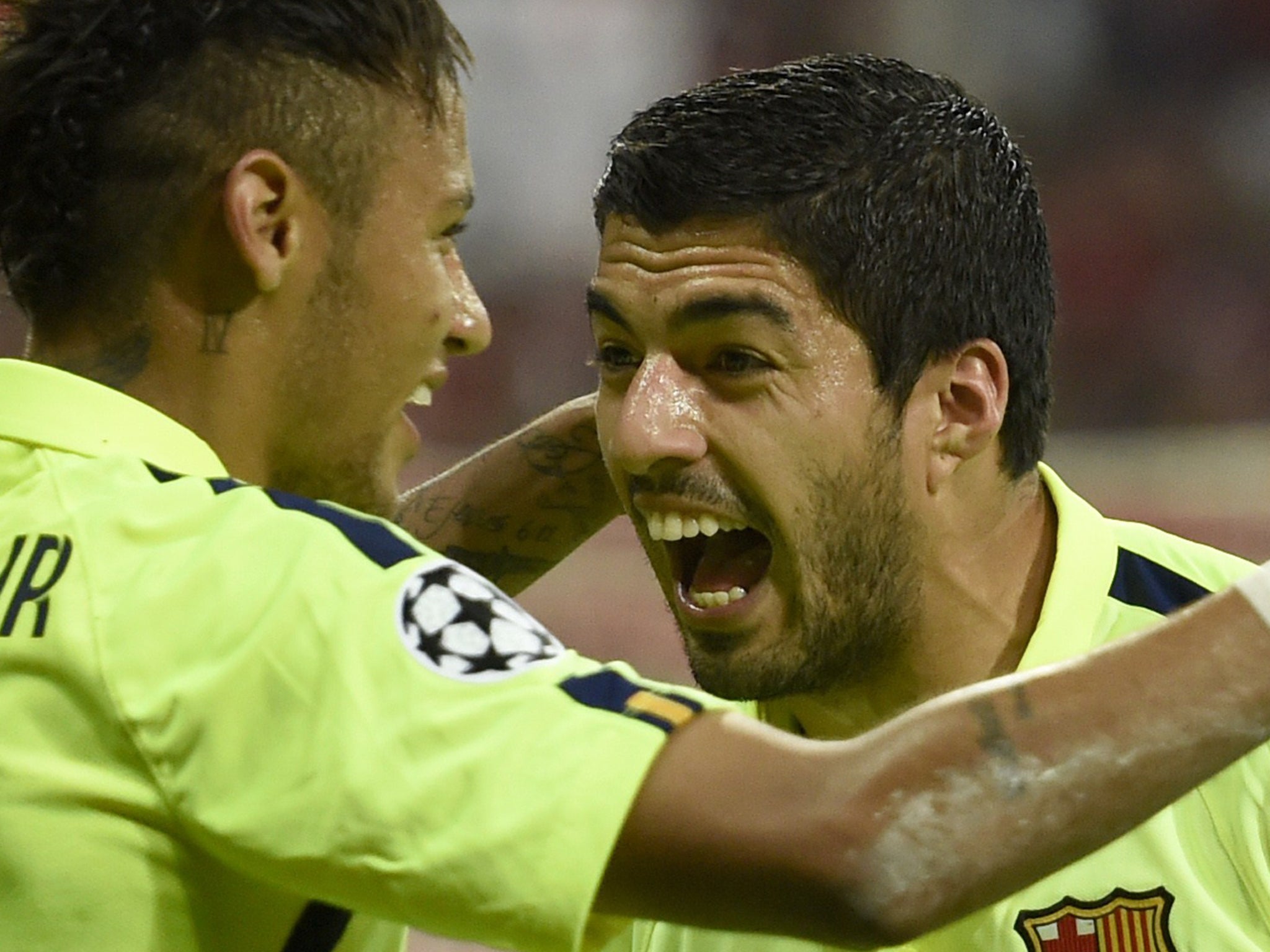 Luis Suarez celebrates with Neymar after the latter's goal against Bayern Munich