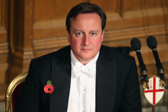 David Cameron listens to the speeches in the Guildhall during The Lord Mayor's Banquet 2013