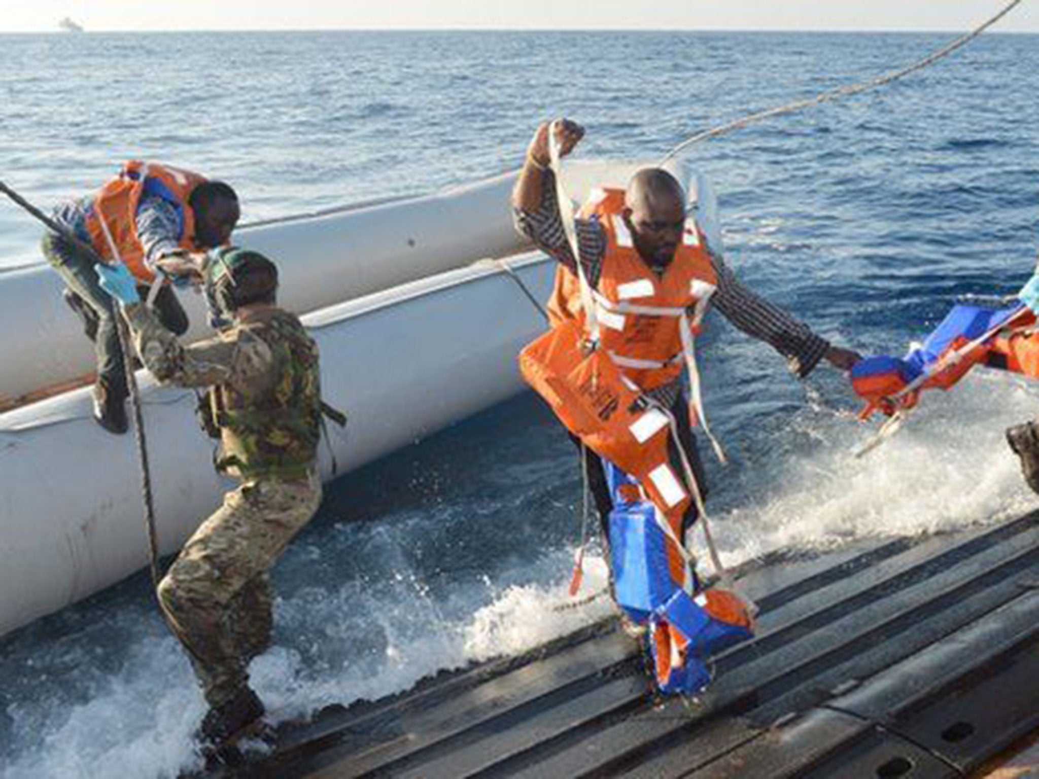 Royal Navy rescue migrants after receiving dstress call from Italian Coastguard