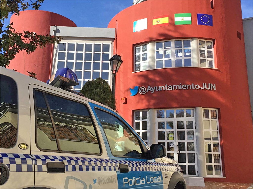 A police car - proudly sporting the local force's twitter handle - sits outside Jun's town hall
