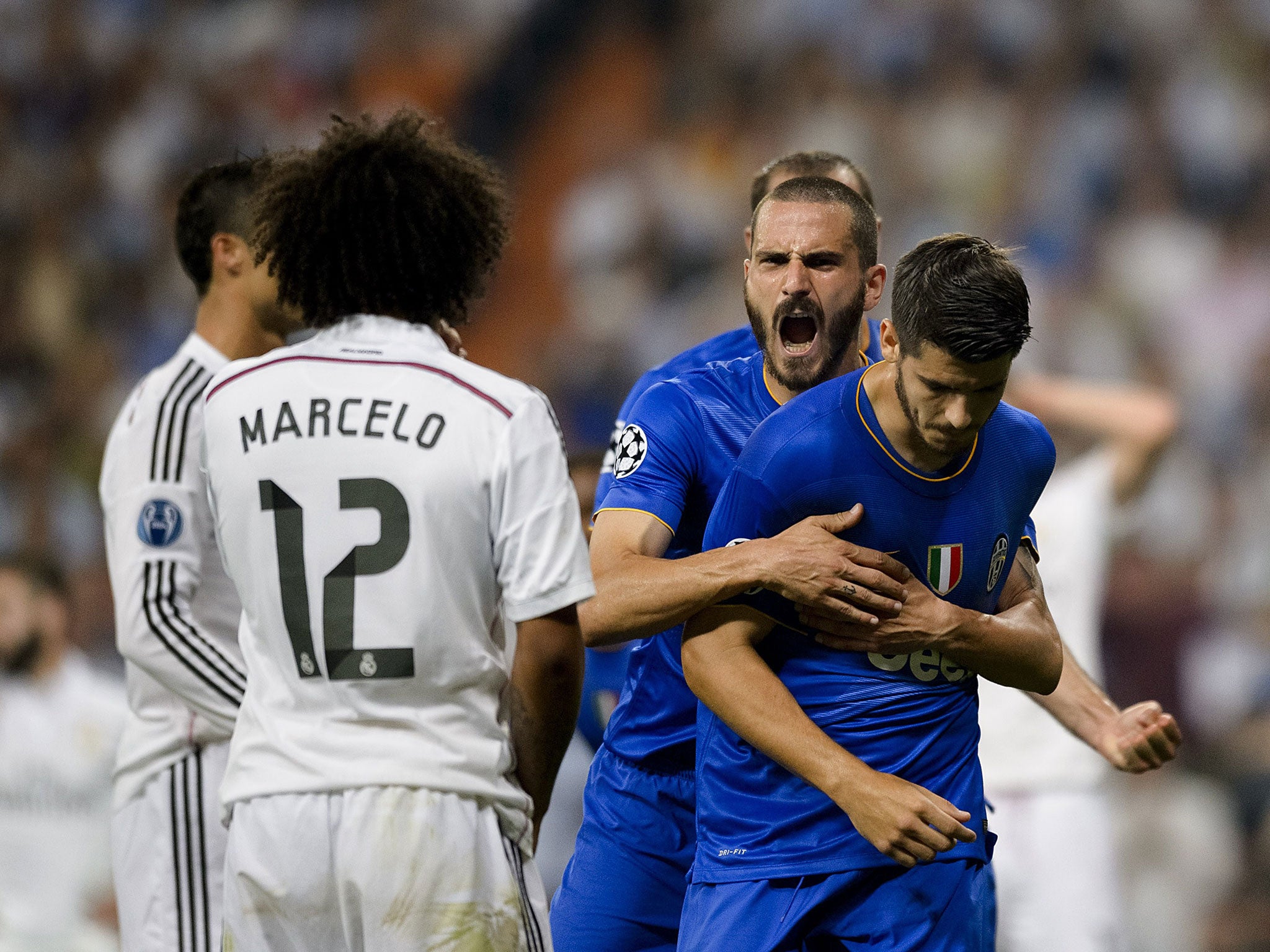 Former Real star Morata (right) does not celebrate his goal