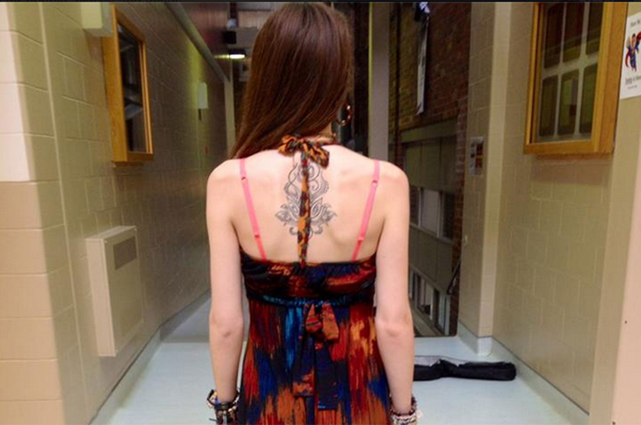 Lauren Wiggen shows the dress she was given detention for after it was deemed 'inappropriate' by her school