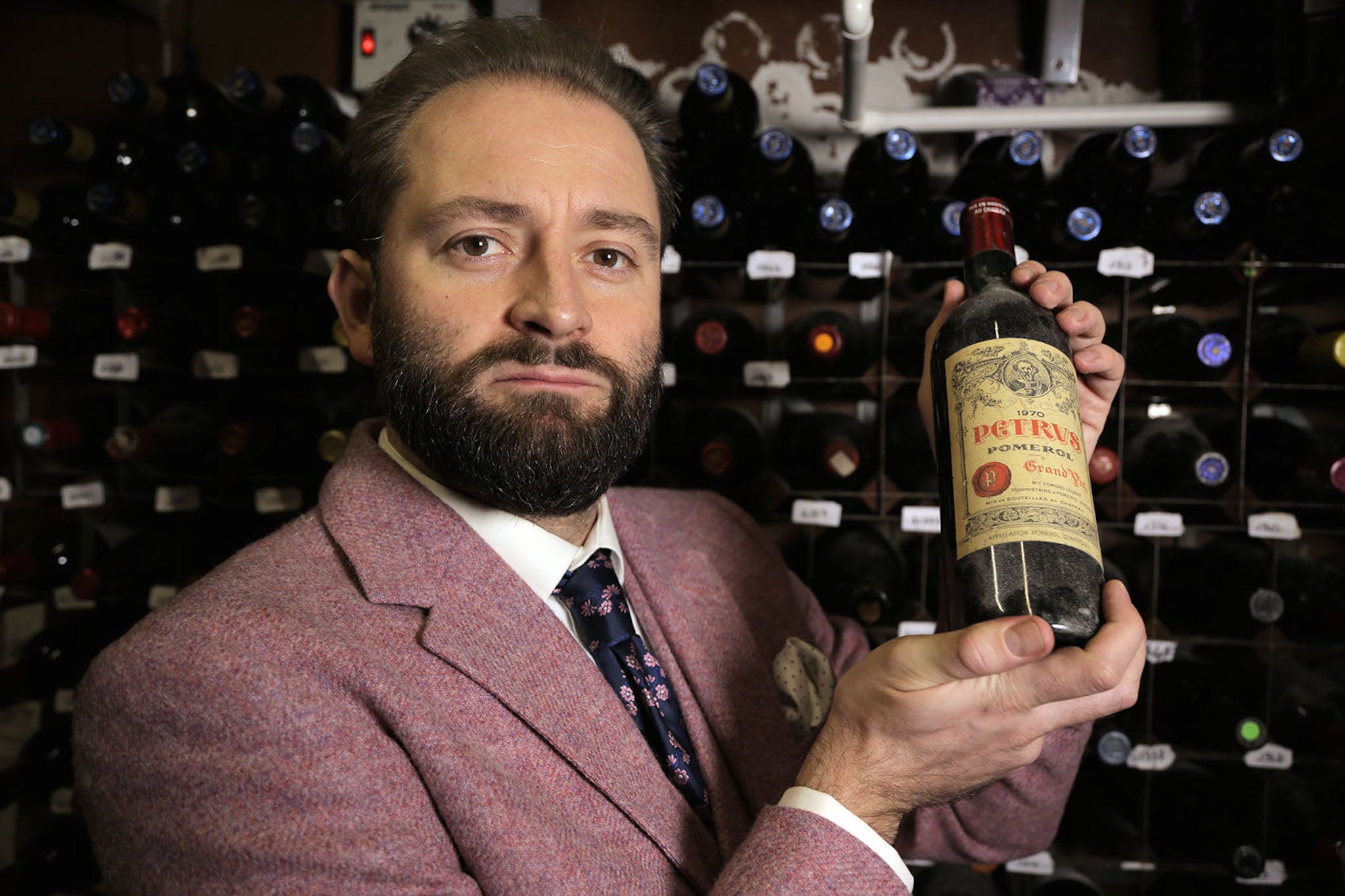 Wine expert Tom Harrow with his rare vintages on Channel 4's The World's Most Expensive Food
