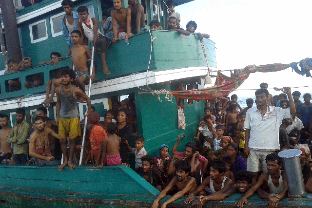Rohingya migrants are pictured on a boat off the southern Thai island of Koh Lipe in the Andaman Sea on May 14, 2015