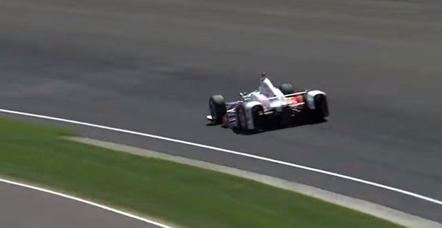 Castroneves' car twitches and begins to head to the outside of the track