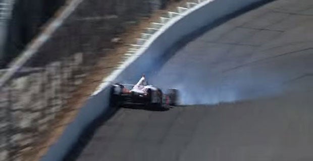 Castroneves' Team Penske IndyCar crashes into the concrete barrier