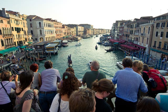 A bridge too far: increasing numbers of day-trippers are crowding Venice’s attractions such as the Rialto Bridge