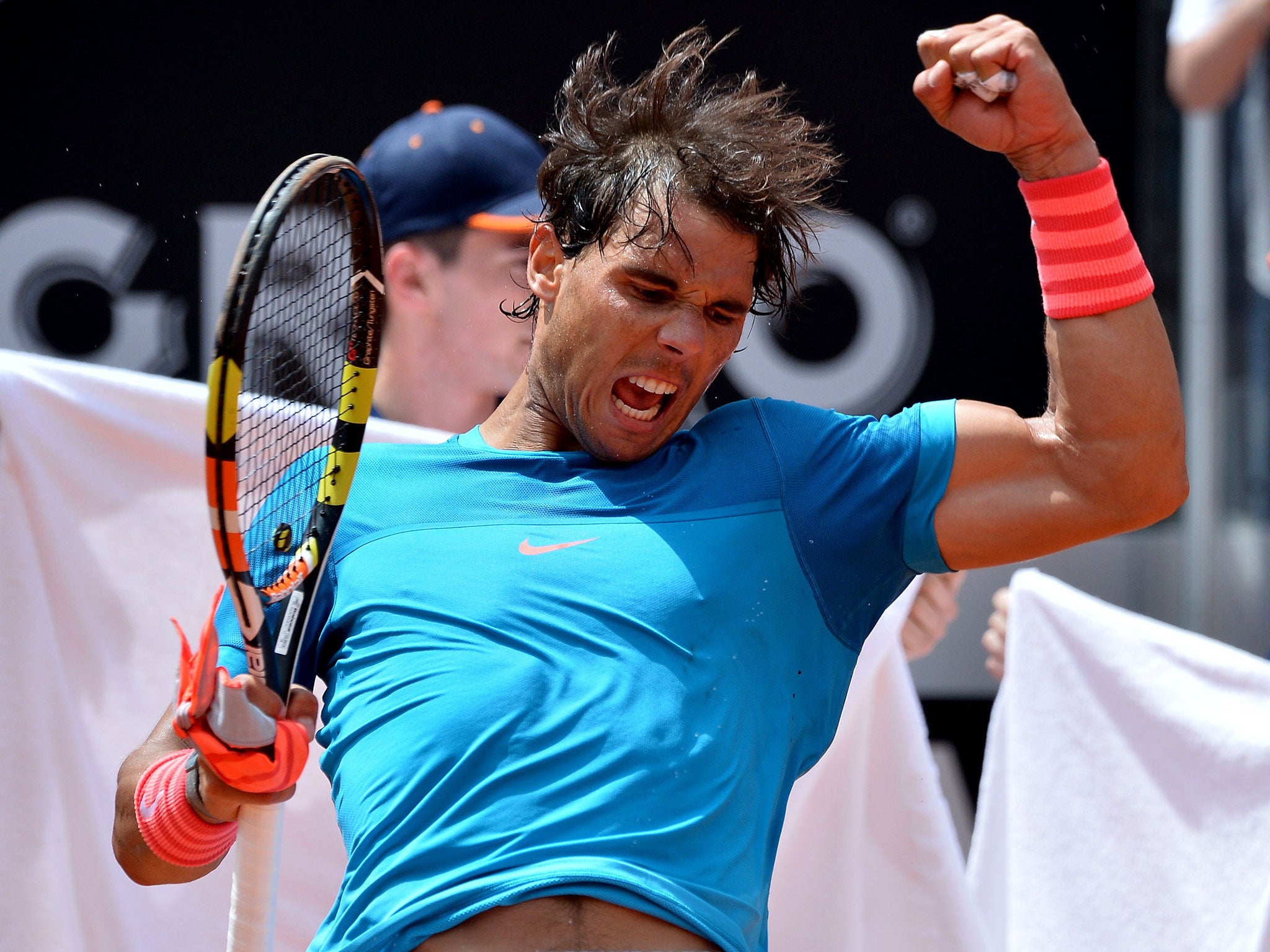 Rafael Nadal celebrates after beating John Isner in Rome