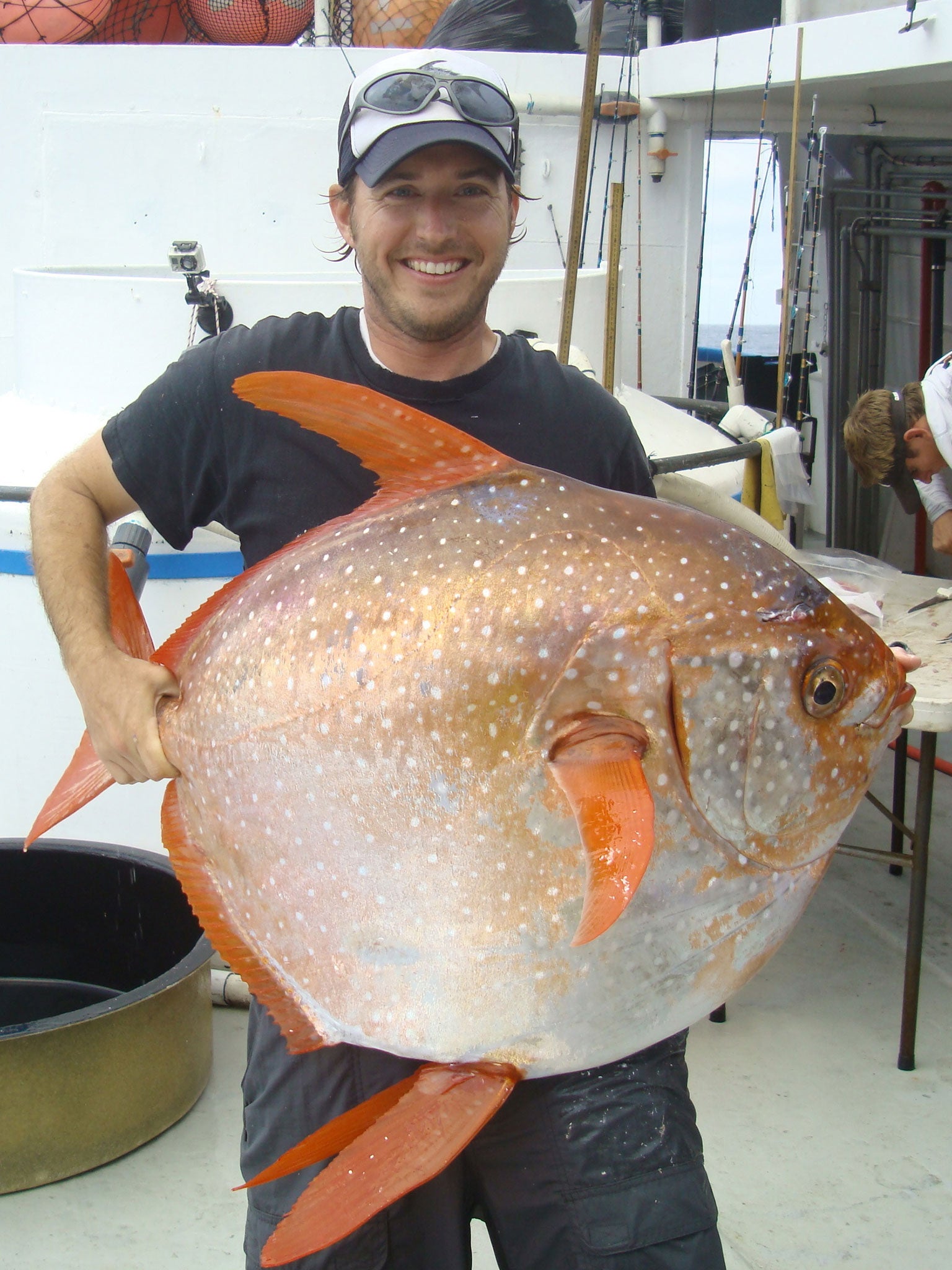 Nicholas Wegner with a moonfish, or opah, the world’s only warm-blooded fish