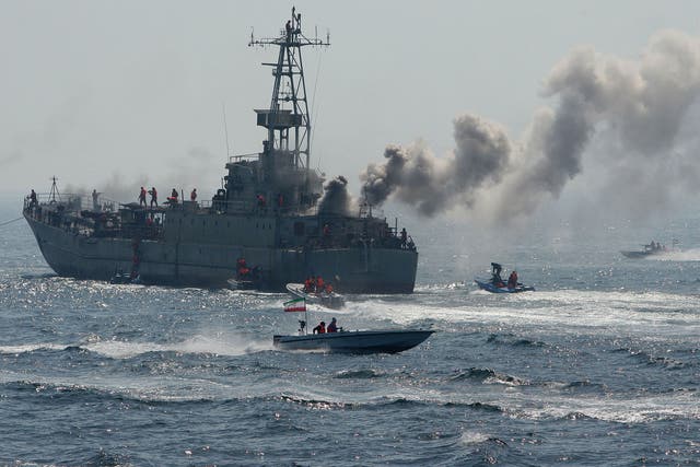 US officials have said that Iranian naval vessels have fired shots at a Singapore-flagged tanker in the Gulf in what appeared to be Iran's latest attempt to settle a legal dispute by force with passing commercial vessels