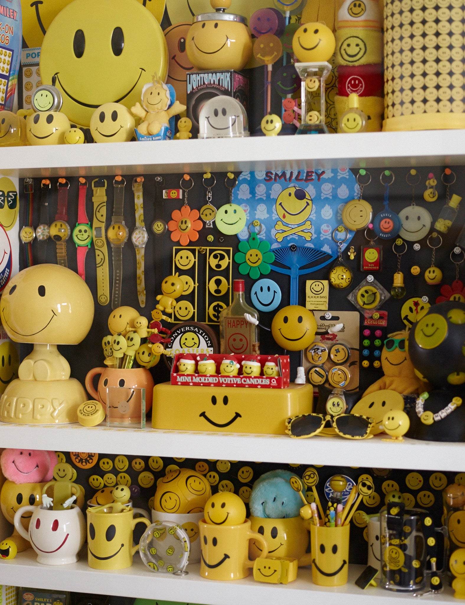 One cabinet in Cook's house spills over with smiley-faced tchotchkes