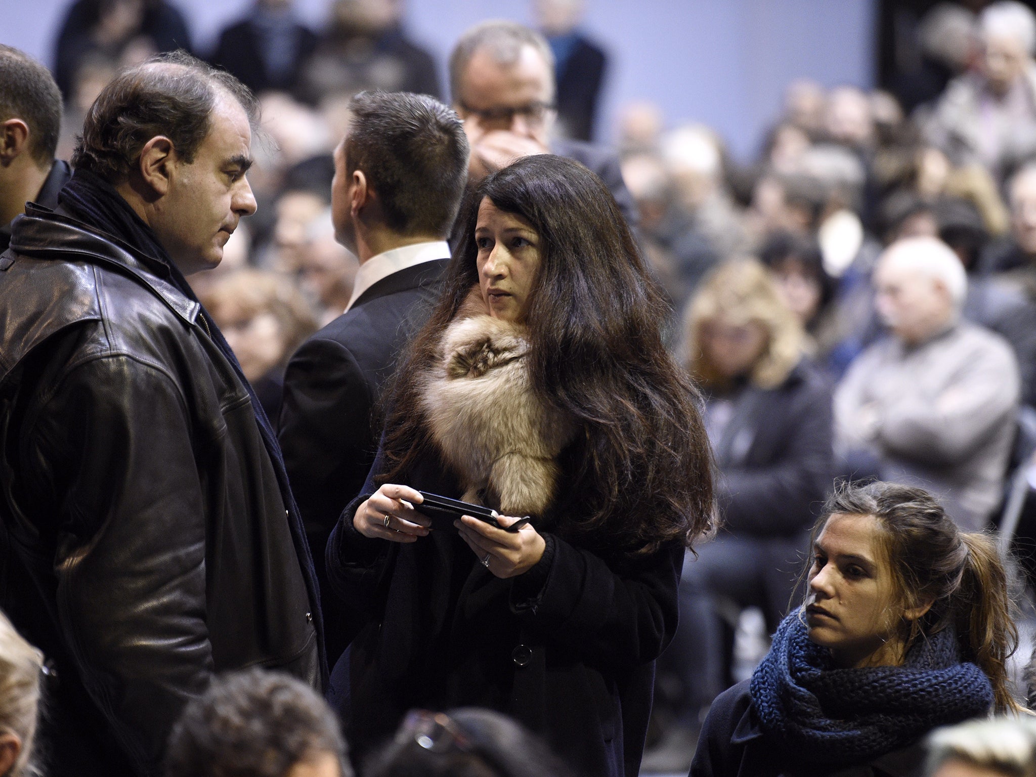 Charlie Hebdo's journalist Zineb El Rhazoui (C) attends the funeral ceremony of French cartoonist and Charlie Hebdo editor Stephane 'Charb' Charbonnier, on January 16, 2015 in Pontoise, outside Paris.