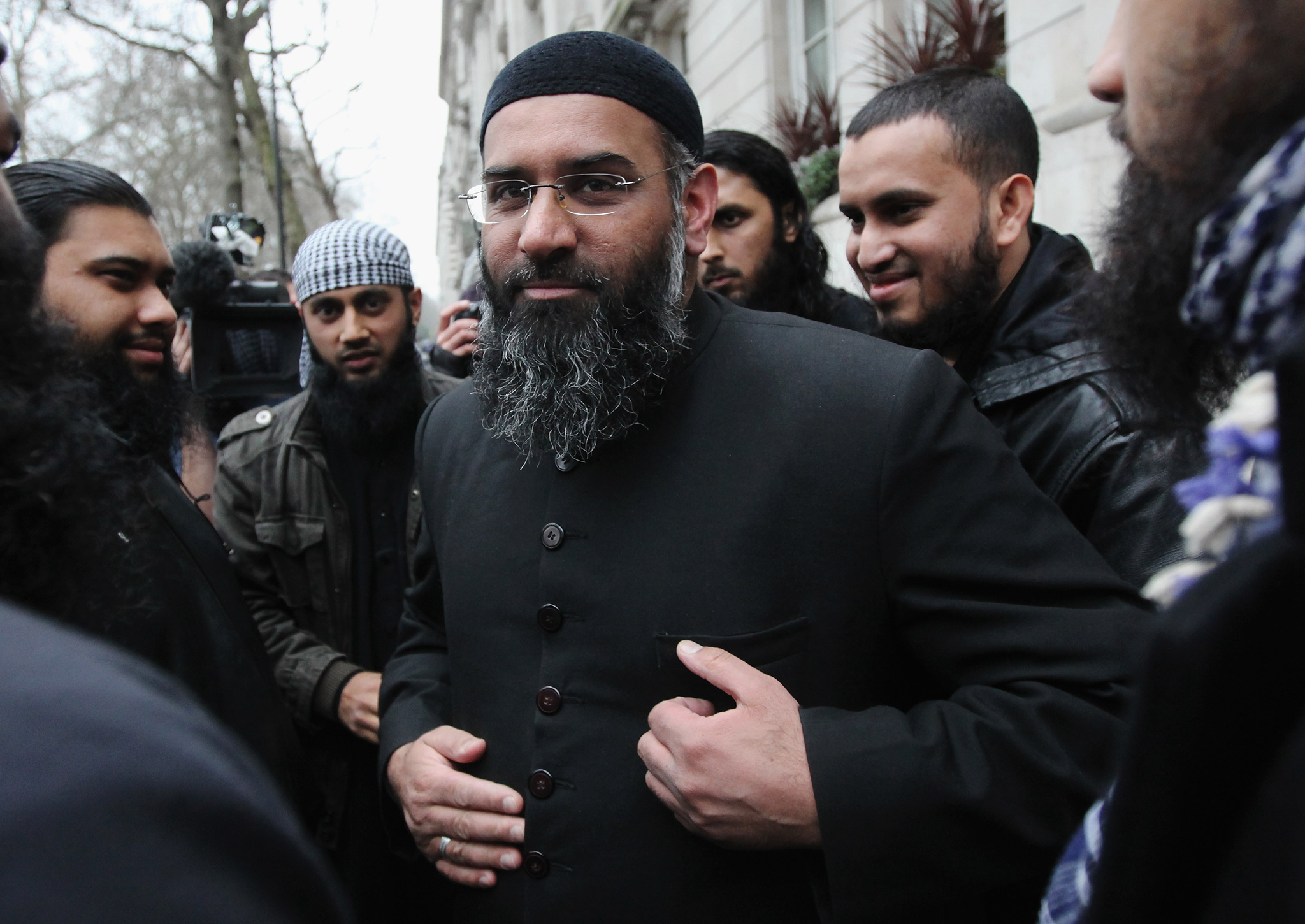 Anjem Choudary leaves a press conference in Millbank Studios in 2010