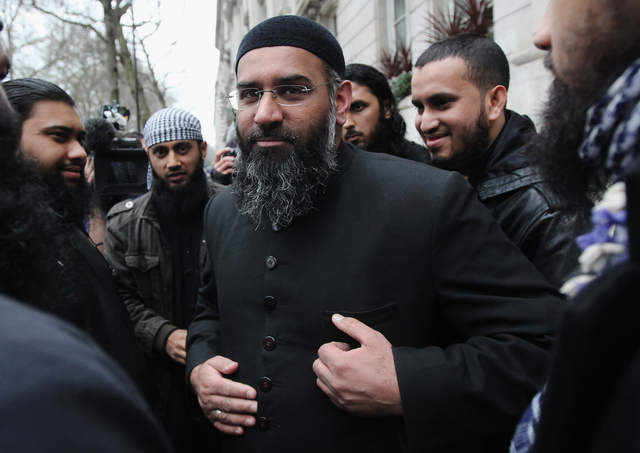 Anjem Choudhary leaving a press conference in Millbank Studios 