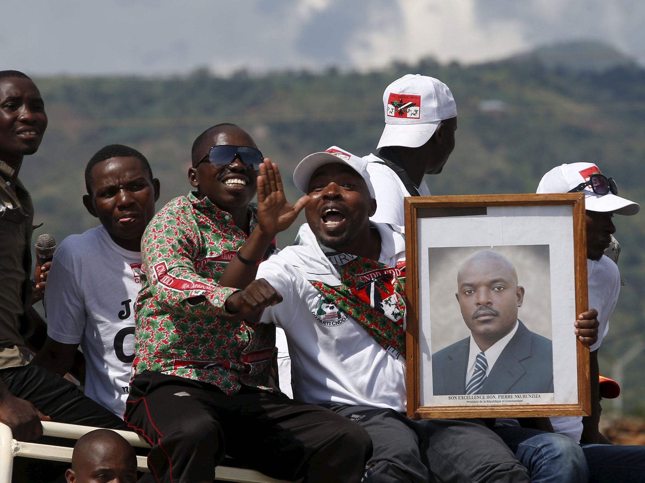Supporters of President Pierre Nkurunziza wait for him to return to the capital