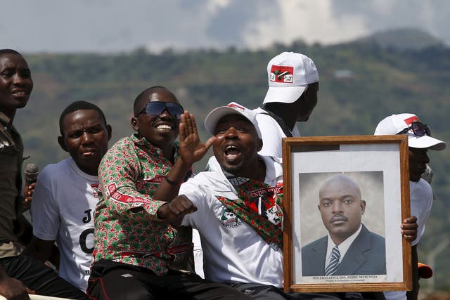 Supporters of President Pierre Nkurunziza wait for him to return to the capital