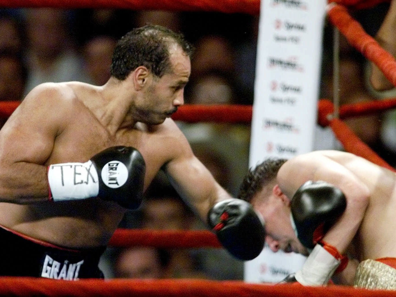 Tony Ayala, Jr., left, knocks down  Manuel Esparza during the third round in his comeback match after 16 years in prison