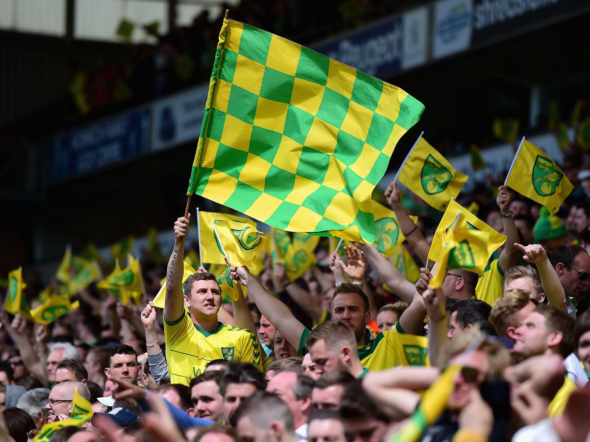 Norwich fans celebrate the win over Ipswich