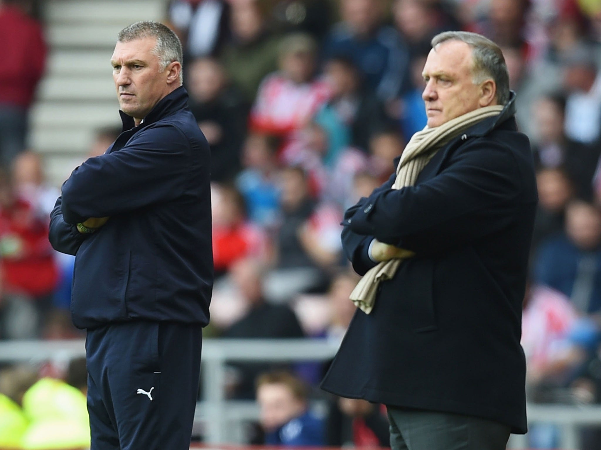 Nigel Pearson's team will be in the Premier League next season but Dick Advocaat will learn his fate next week