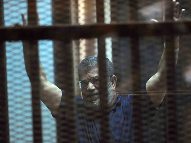 Mohamed Morsi as he is sentenced to death in a Cairo courtroom on Saturday